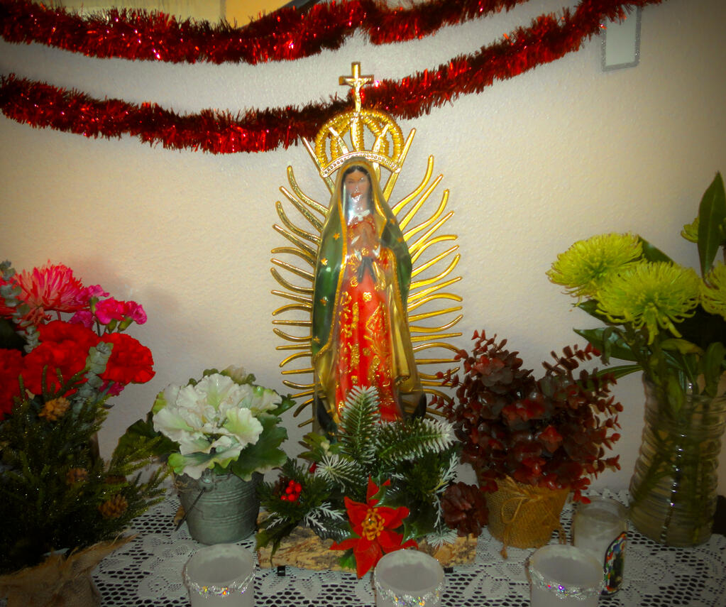 12.15.2024 tried to take a pic of the altar, but the plastic wrap my nana won't let us remove is kinda in the way. lol!
